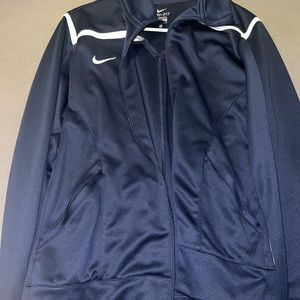 Large gently used nike jacket. Color is navy and white.